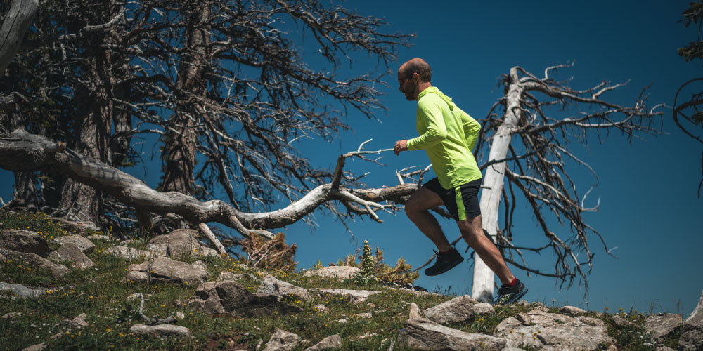 Man running up hill in Mij gear
