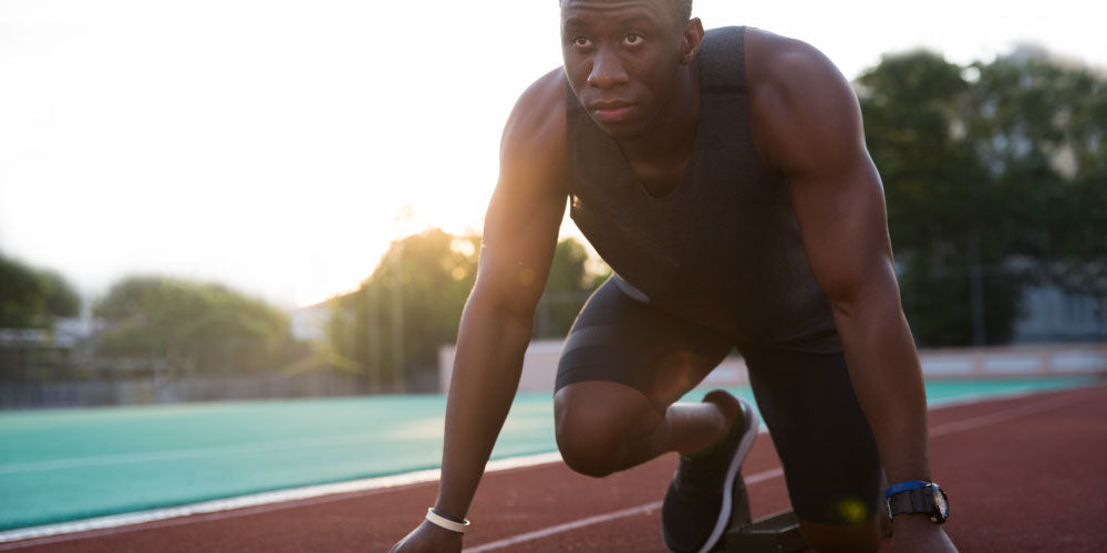 Man about to start running wearing wearable devices