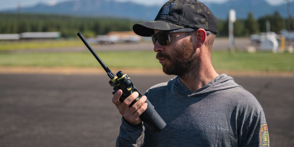 Man with radio in stressful rescue situation