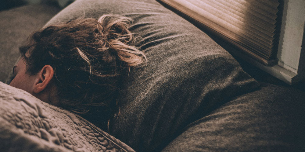 woman asleep in bed photo credit Greg Pappas