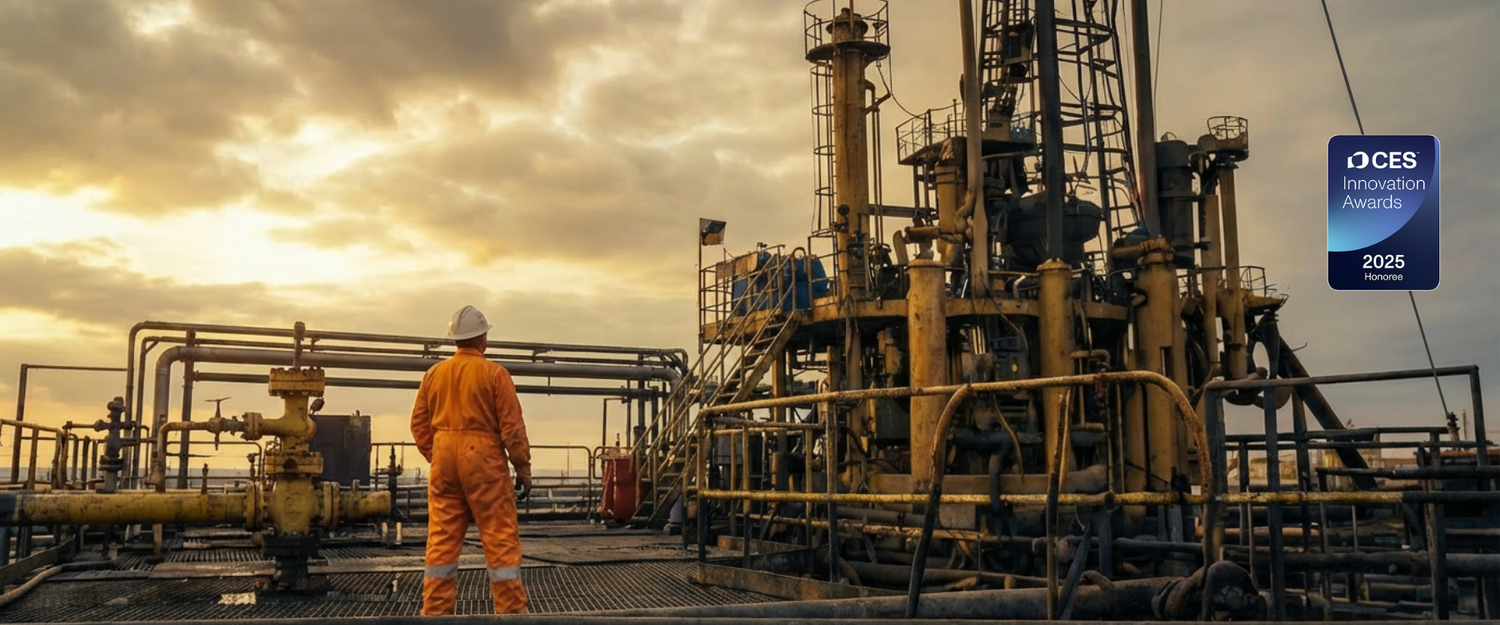 Person in orange safety suit standing on an oil rig with CES 2025 Award logo in the corner.